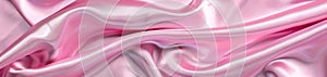 Elegant pink satin cloth with a silky texture and cascading folds, embodying a sense of softness and luxury.