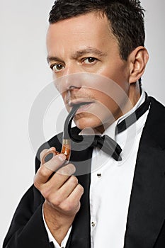 Elegant pipe smoker on white background.