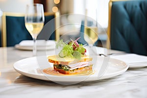 elegant plating of croque monsieur at a high-end brasserie