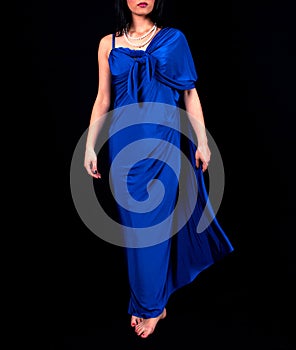 Elegant Pose: Woman in Electric Blue Maxi Dress