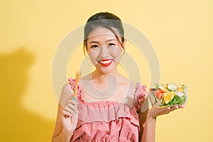 Elegant pretty slim woman eating healthy salad