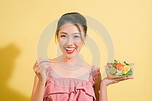 Elegant pretty slim woman eating healthy salad