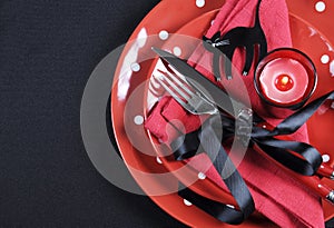 Elegant red and black theme Halloween party dining Table place setting with copy space.