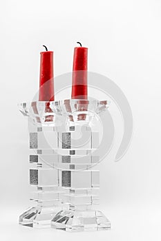 Elegant red candles in glass candleholders