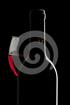 Elegant red wine bottle and wine glass