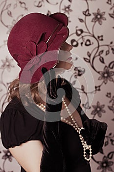 Elegant retro woman in vintage hat half face