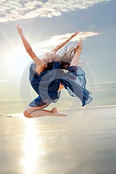 Elegant rhythmic jump at sunset