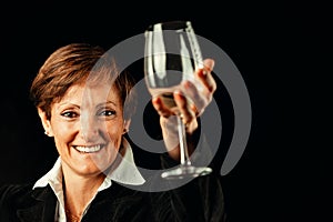 Elegant senior toasts millennia of wine culture photo