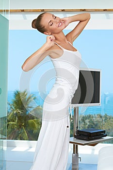 Elegant shapely woman stretching