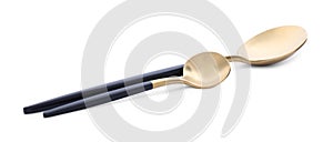 Elegant shiny golden spoons on white background