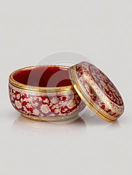 Elegant Sindoor Container With Gold Rim Showcasing Intricate Designs in Traditional Style photo
