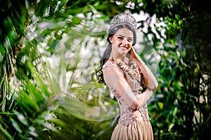 Elegant smiling lady with tiara on a head