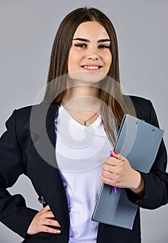 Elegant smiling woman in jacket. trendy office worker. formal casual fashion style. stylish woman hold office folder