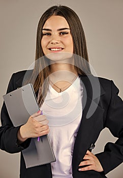 elegant smiling woman in jacket. trendy office worker. formal casual fashion style. stylish woman hold office folder