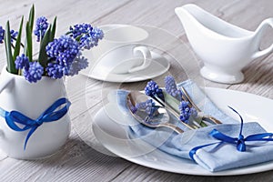 Elegant spring table setting with flowers muscari