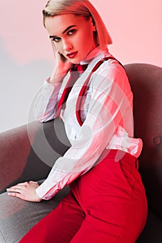 elegant stylish girl posing in armchair,