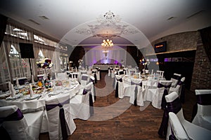 Elegant and stylish purple color wedding reception at luxury restaurant