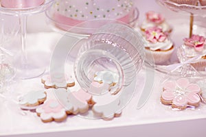 Elegant sweet table with cupcakes and other sweets for dinner or