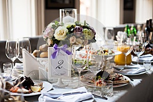 Elegant table arrangement and catering at wedding reception, sty