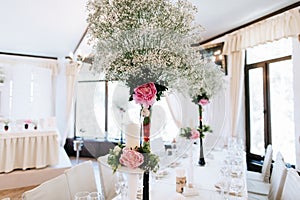 Elegant table arrangement and catering at wedding reception. Wedding decoration in restaurant