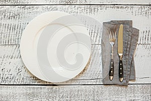 Elegant table place setting on white wooden table. Top view