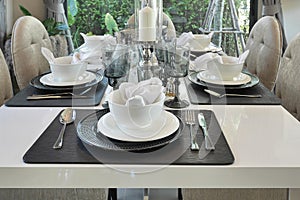 Elegant table set on dining table in modern style dining room