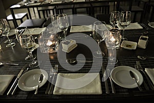 Elegant Table Set, Lighted Candles, White Folded Napkin - Modern Restaurant