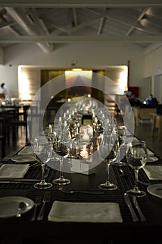 Elegant Table Set, Lighted Candles, White Napkins - Modern Restaurant