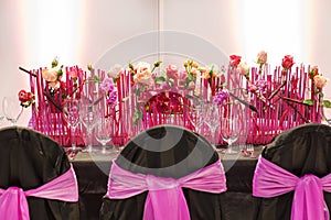 Elegant table set in pink for wedding or event party.