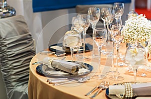 Elegant table set in soft creme for wedding or event party.