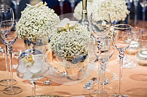 Elegant table set in soft creme for wedding or event party.