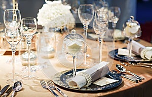 Elegant table set in soft creme for wedding or event party.