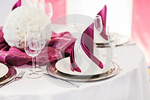 Elegant table set in soft creme for wedding or event party.