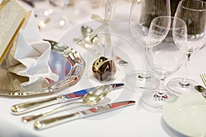 Elegant table set in soft creme for wedding or event party.