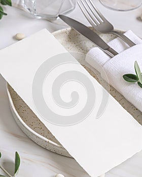 Elegant Table setting with a card decorated with eucalyptus branches close up, Wedding mockup