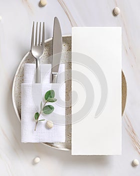 Elegant Table setting with a card decorated with eucalyptus branches top view, Wedding mockup