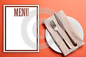 Elegant table setting and empty menu on background, flat lay. Space for text