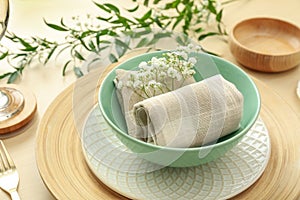 Elegant table setting with flowers and leaves