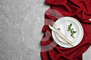 Elegant table setting on grey marble background. Space for text