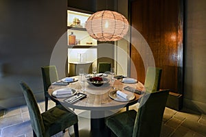 Elegant table setting in illuminated restaurant corner