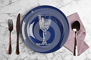 Elegant table setting on white marble background