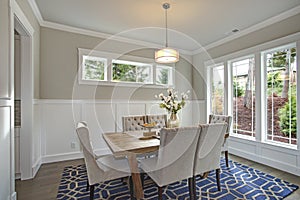 Elegant transitional dining room with board and batten walls