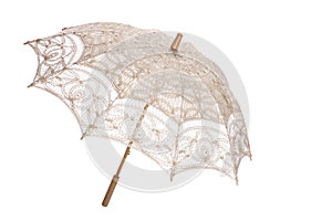elegant umbrella used in wedding and arti with cream lace on white background photo