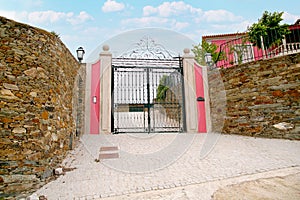 Elegant villa entrance with iron gate