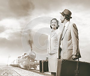 Elegant vintage couple leaving with luggage