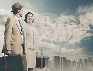 Elegant vintage couple leaving with luggage