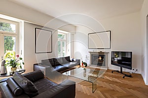 Elegant vintage living room with leather sofa in a stately villa. Parquet floor