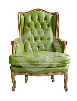 Elegant vintage wooden armchair with green leather upholstery and pillow isolated on white background