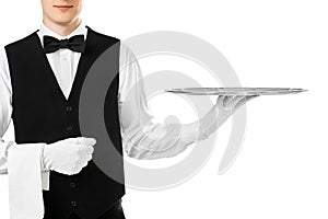 Elegant waiter holding empty silver tray