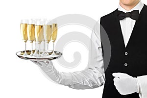 Elegant waiter serving champagne on tray